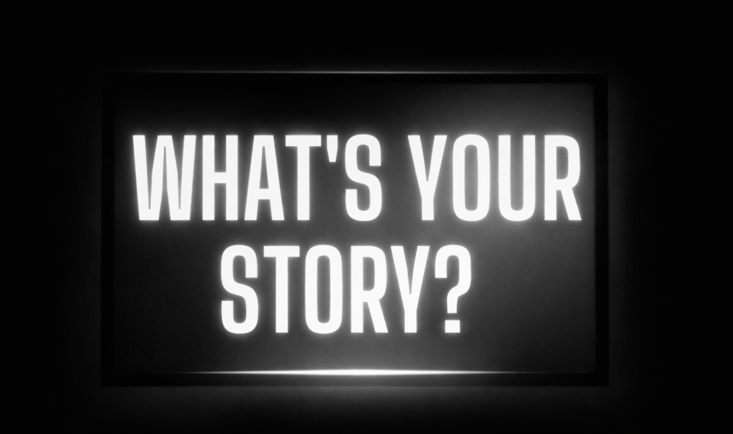 Bold illuminated text asking “What’s your story?” representing brand storytelling and content strategy in digital media marketing